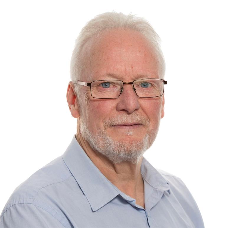 Older man with glasses, white hair, light blue shirt at the 2025 Leaders Conference.