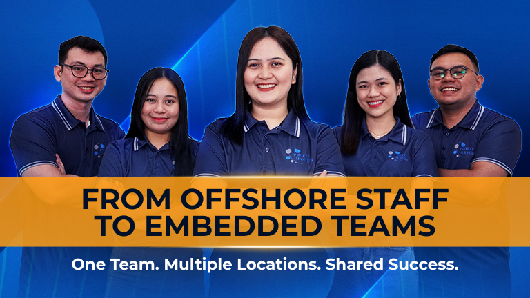 Five people in matching shirts promote Embedded Teams behind a banner at the event.