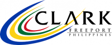 Logo of Clark Freeport Zone in the Philippines, featuring swooshes in blue, yellow, green, and red, with the word "Clark" in large letters and "Freeport Philippines" beneath. Commemorating their 10th Anniversary Conference with a design that speaks to vibrant growth and innovation.